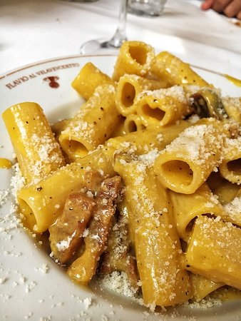 Flavio al Velavevodetto (IT) signature dishes Homemade Ravioli Stuffed with Ricotta Cheese with Fresh Tomato and Basil
Rigatoni Alla Carbonara
Tonnarelli Cacio E Pepe